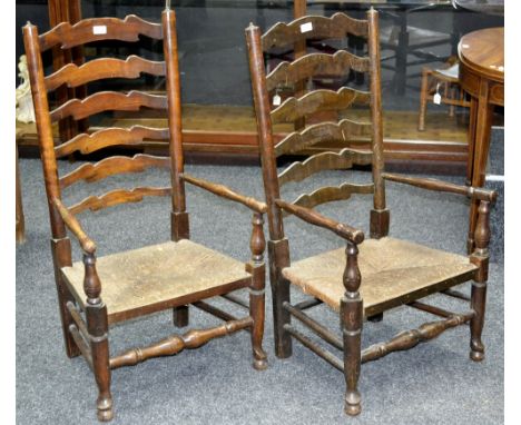 A pair of 19th century ladder back nursing chairs with rush seats, c.1860 (2)
