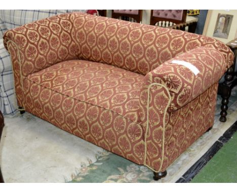 A Victorian drop arm two seat sofa 