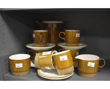 A 1960's Poole Pottery Choisya pattern coffee set, comprising coffee pot, six cups, six saucers, sugar and cream, produced as