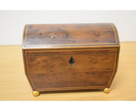 A 19th/20th century yew wood two compartment tea caddy, of domed and hinged rectangular form with string inlaid banding and t