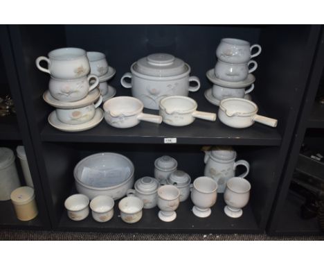 A collection of Denby stoneware, having pale grey ground with pink and pale green floral pattern, soup dishes, tureen, beaker