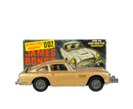 James Bond Boxed Corgi Aston Martin DB5 for "Goldfinger" A boxed Corgi number 261 Aston Martin DB5 in gold with inner packagi