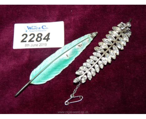A green enamelled Stirling Silver Brooch depicting a feather and a white metal simulated diamond Brooch depicting a fern leaf