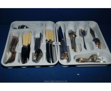 A quantity of stainless steel cutlery including knives, forks, spoon and jam spoon.