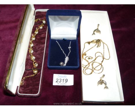 A pretty Dolphin 28" necklace with matching earrings, a 925 gold coloured pearl bracelet and a 20" grey pearl pendant and cha