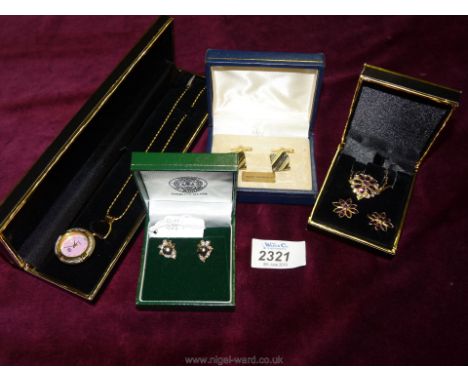 A nurses watch and chain, red stone pendant and chain with matching earrings, pair of West German gold coloured cufflinks and