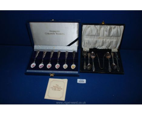 A boxed set of teaspoons with enamel bowls depicting various colourful exotic flowers and a cased set of teaspoons.