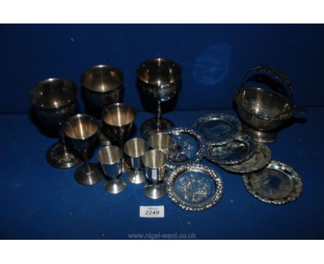 A quantity of silver plate including tot glasses and goblets, sugar basket and spoon, small coasters etc.