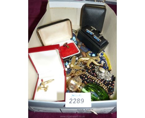 A quantity of costume jewellery including egg timer cufflinks, gardening cufflinks etc