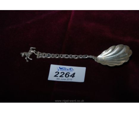 A silver '835' spoon with horse on top.