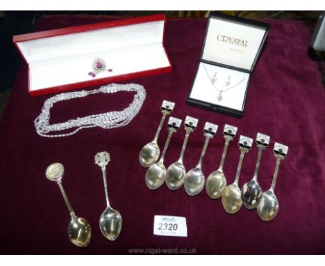 A Sarah Cov eight strand necklace and brooch, a 16" Austrian crystal, nine stone pendant and chain with matching earrings and