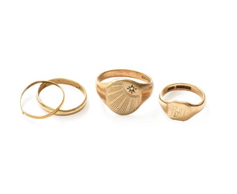 Two 9 carat gold signet rings, finger sizes J and U; a 9 carat gold band ring (a.f.); and a band ring, unmarked, band cutThre