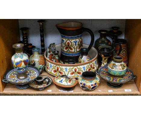 Collection of Gouda pottery to include a large bowl, decanter and stopper, various candlesticks, decorated in typical fashion