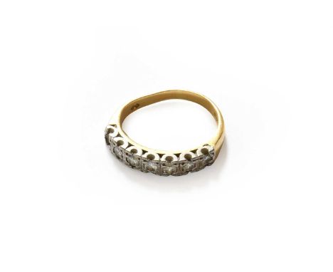An 18 carat gold seven stone diamond ring (a.f.)one stone lacking and the band is out of shape. Gross weight 3.0 grams.