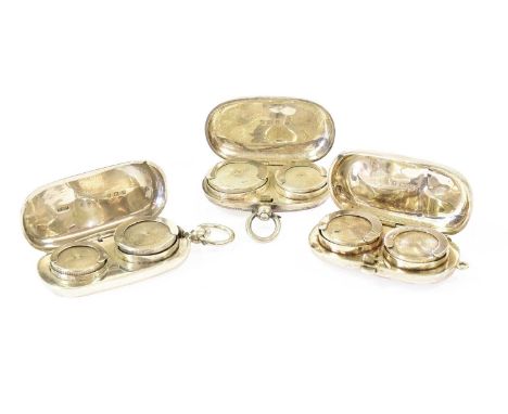 Three Silver Double-Sovereign Cases, two plain oval and with drop-ring handles, the third oval and engraved with foliage, eac
