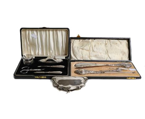 Cased composite manicure set, cased silver shoe horn and button hook, two smaller hooks, epns purse