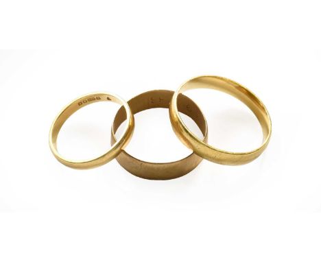 Two 18 carat gold band rings, finger sizes M1/2 and V; and a 9 carat gold band ring, finger size S18 carat gold band rings - 