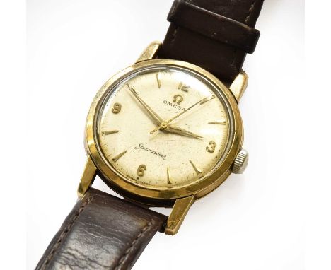A 9 carat gold centre seconds wristwatch, signed Omega, Seamaster, (calibre 520) manual wound lever movement signed and numbe
