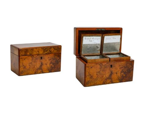 A Victorian burr walnut tea caddy containing two compartments, with domed and hinged covers, 25cm wide