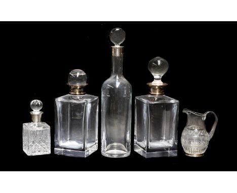 A Collection of Silver-Mounted Glass, comprising: a cylindrical decanter, the glass by Baccarat, the silver mounts by Theo Fe