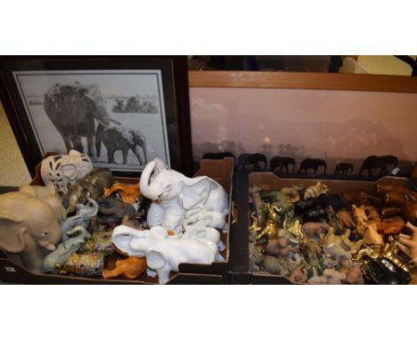 A collection of elephants including ceramic, glass, resin, wood, etc.; framed elephant prints; quantity