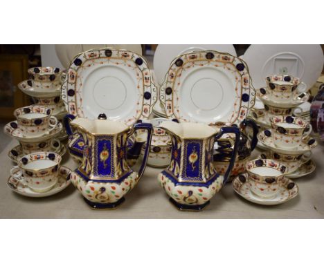 An Edwardian Imari palette porcelain tea service, c.1900; similar earthenware (qty) 