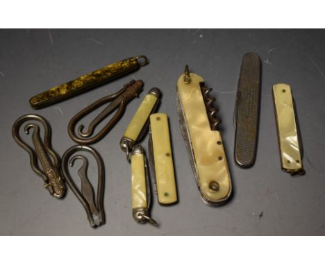 A collection of seven penknives; three button hooks (10)