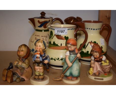 A Devon Motto Ware water jug; others; a Goebel figure by Hummell Happy Pastime; others (8) 