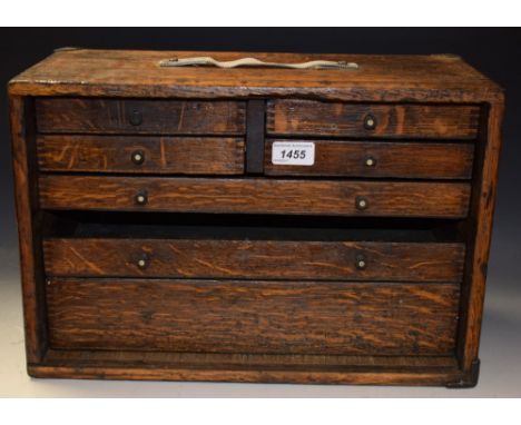 An early 20th century oak collector's / engineer's tool cabinet, fitted with an arrangement of drawers, 43cm wide, 29cm high