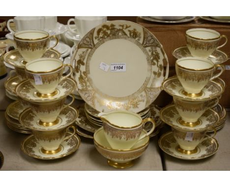 Foley and Noritake part tea service, gilded decoration on yellow ground, comprising twelve cups and saucers, twelve side plat