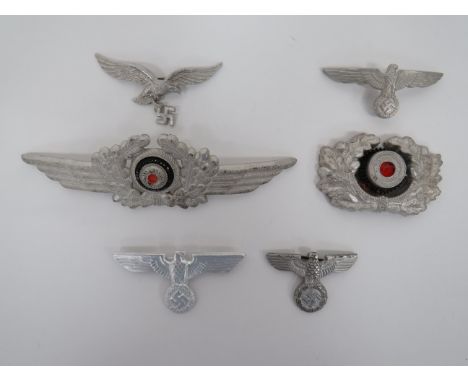 Small Selection of German Third Reich Badgesconsisting alloy Luftwaffe winged wreath and eagle and swastika cap badges ... Al
