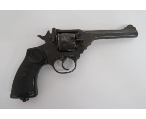 Deactivated Mark IV Webley Service Revolver.38, 4 3/4 inch, blued barrel.  Fluted six shot cylinder.  Blued body stamped 'War