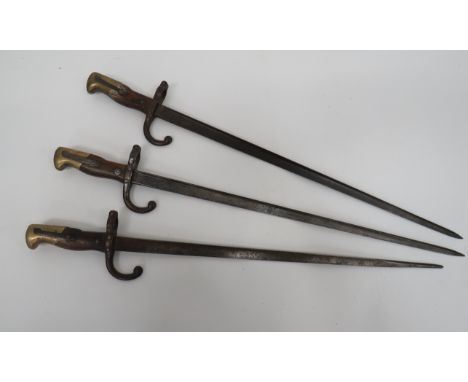 Three French M1874 Gras Bayonets20 3/4 inch, T section blade (one shortened to 19 1/2 inch).  All with maker's details and da
