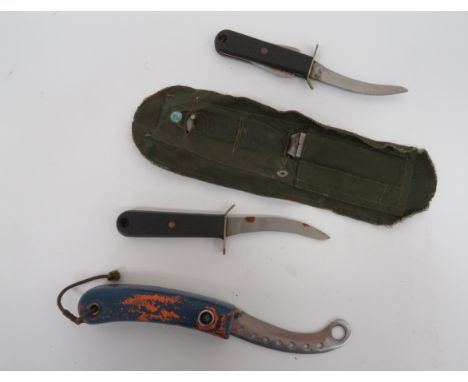 Three Various Air Force Survival Dinghy Knivesconsisting 27C/2023 curved blade example.  Orange, cork handled, dinghy knife .