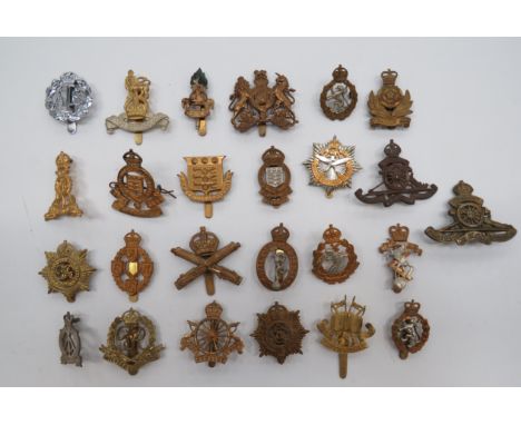 Selection of Corps Cap Badgesincluding KC brass MGC ... KC brass Military Police ... QC brass Intelligence Corps ... Brass Ar