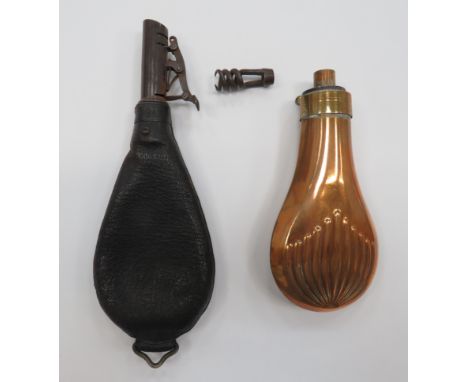 Two 19th Century Flasksconsisting copper and brass powder flask.  The body with stylised flower design.  The top with externa