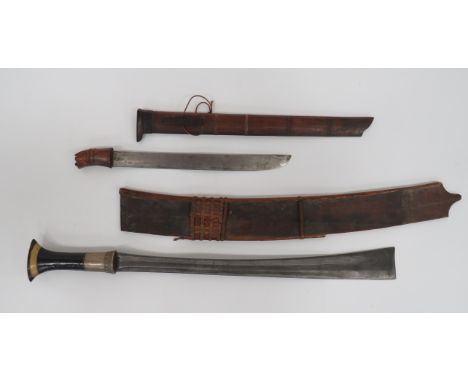 Assam Naga Dao Sword19 3/4 inch, single edged, Damascus blade widening towards the square tip.  Large white metal ferrule.  W