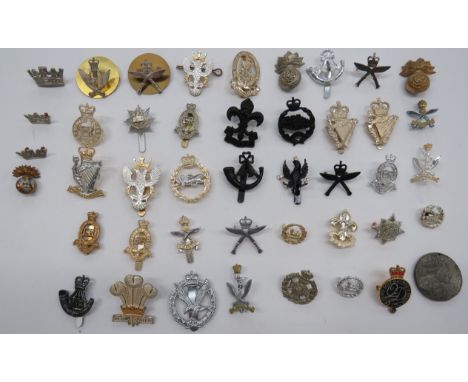 Selection of Various Cap Badgesincluding chrome and gilt Gurkha Engineers ... QC chrome and gilt Gurkha Signals ... QC brass 