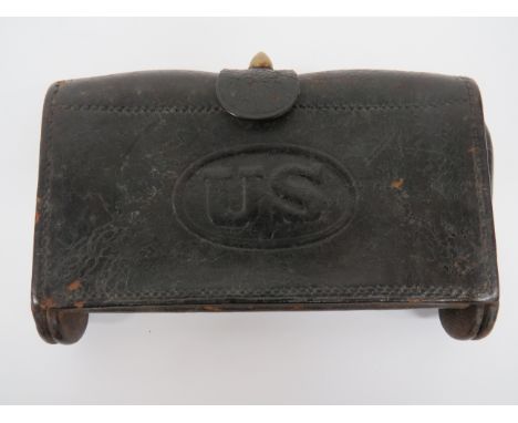 American McKeever Military Ammunition Pouchblack leather base, hinged rectangular pouch.  The front with stamped 'US'.  Rear 