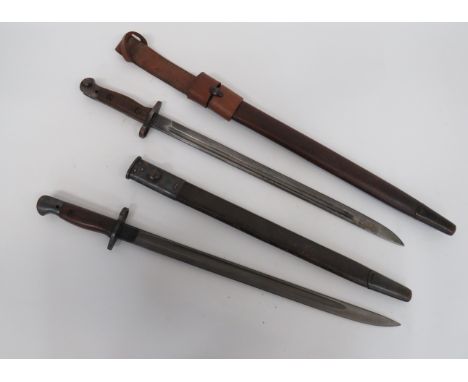 Two WW1 SMLE Bayonets17 1/4 inch, single edged blades with narrow fuller.  The forte stamped 'Wilkinson' dated '11/18' and 'S