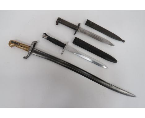 French 184 Sabre Bayonetsingle edged Yataghan blade with central fuller.  Steel crossguard with turn up quillon.  Brass ribbe