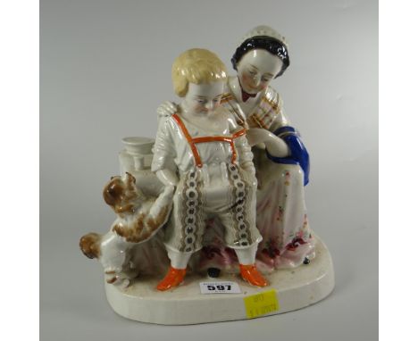 A Staffordshire pottery model of a mother, infant boy &amp; spaniel at a table Condition Report: please request via email. Co