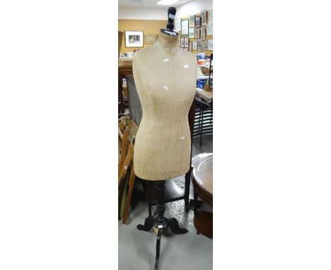 A three quarter size vintage mannequin stamped 'Selfridges, London' on an ebonized tripod base, 157cms high. Condition Report