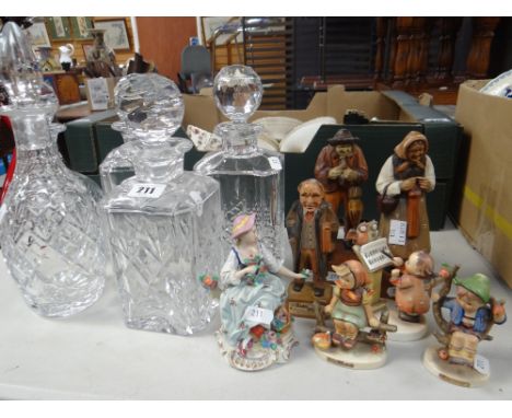 Three Bavarian carved peasant figure souvenirs, three Goebel figures, a continental figurine of a lady &amp; five cut glass d