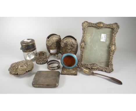 A pair of unusual pebble shaped embossed decorated silver spill holders, a silver &amp; Guilloche enamel pocket watch holder,