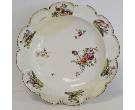 18th century Chelsea porcelain plate of lobed circular form with hand painted polychrome enamel floral sprigging, the basket 