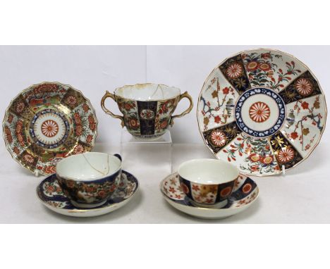 Three pieces of 18th century Worcester porcelain decorated in the Imari palette, comprising: twin handled chocolate cup in "Q