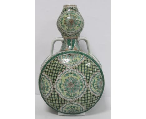 Antique Chinese porcelain vase of twin handled flattened double gourd form decorated with flowerhead panels on lattice ground