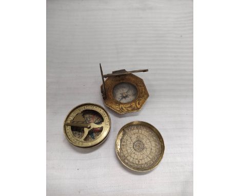 Butterfield style octagonal dial, engraved parcel gilt brass with silvered dial, c1700 and a pocket compass and dial, on pape
