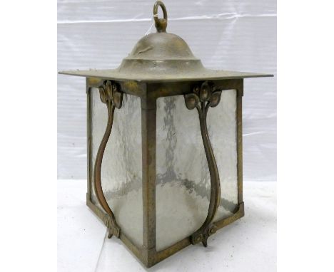 Arts & Crafts brass hall lantern of tapered rectangular form, with domed square top, four foliate strap supports and textured